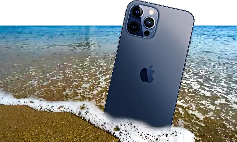 An iPhone 12 Pro in the sand of the Pacific Ocean, off the Califonia coast in Malibu